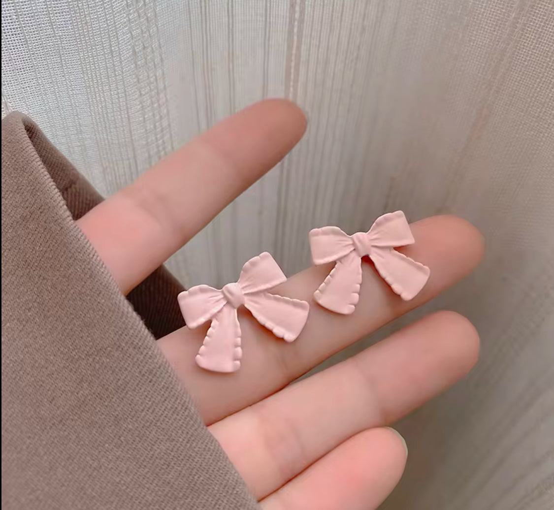 Pink matte bow studs