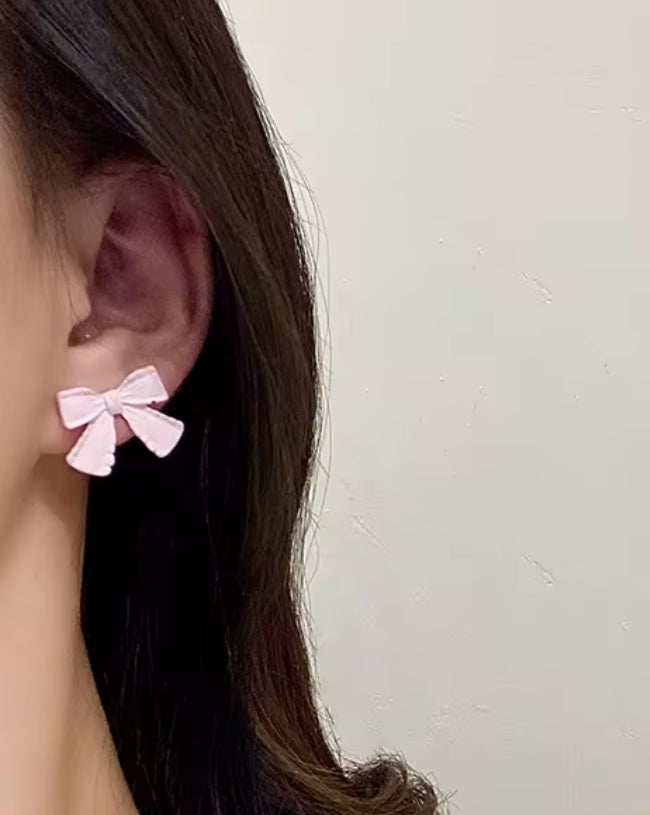 Pink matte bow studs